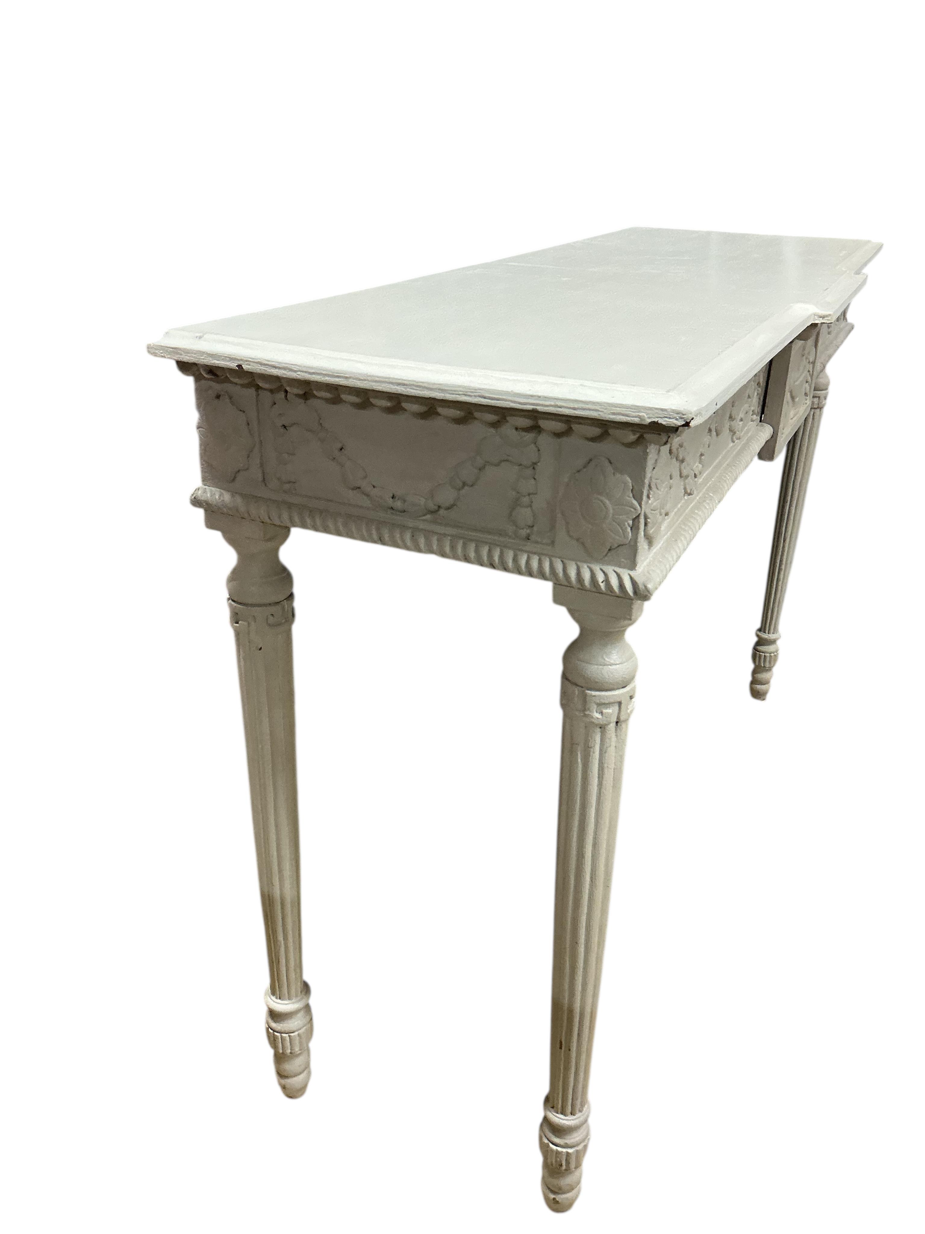 An Adam style painted breakfront console table, width 124cm, depth 41cm, height 81cm